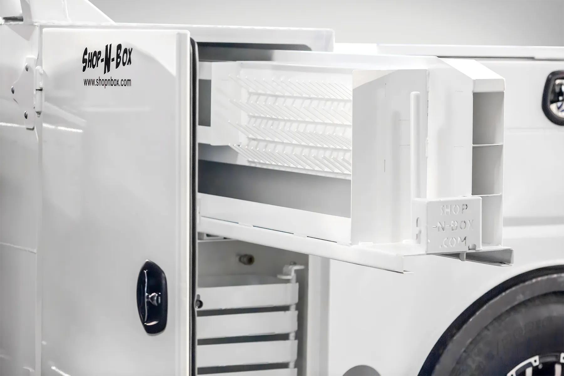 Shop-N-Box™ truck bed drawer system extended showing organized tool storage inserts