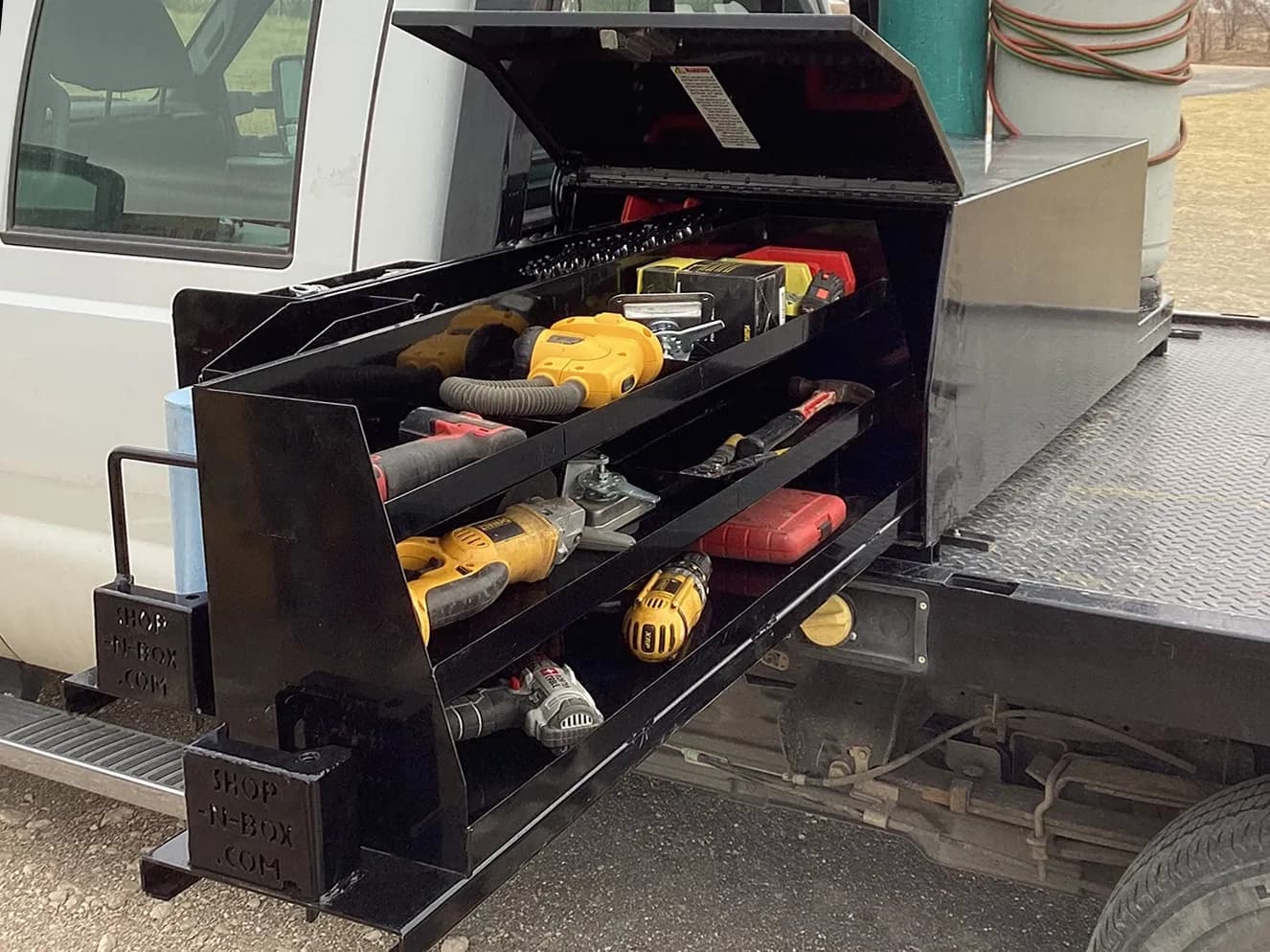 Shop-N-Box™ 2-65B Model truck toolbox storage side with three-tier shelving and parts bin