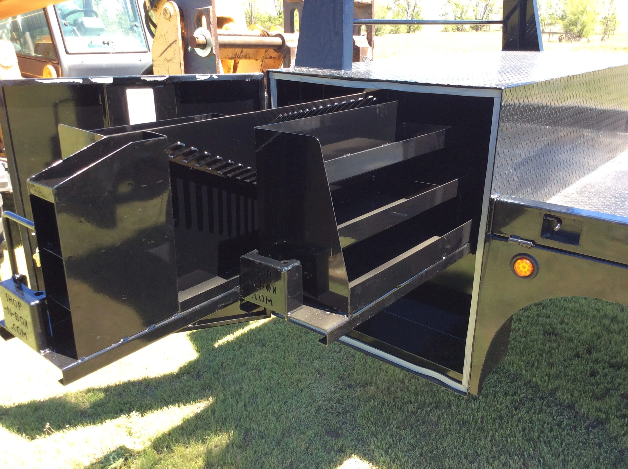 Shop-N-Box Generation 1 flatbed work truck with ladder rack system