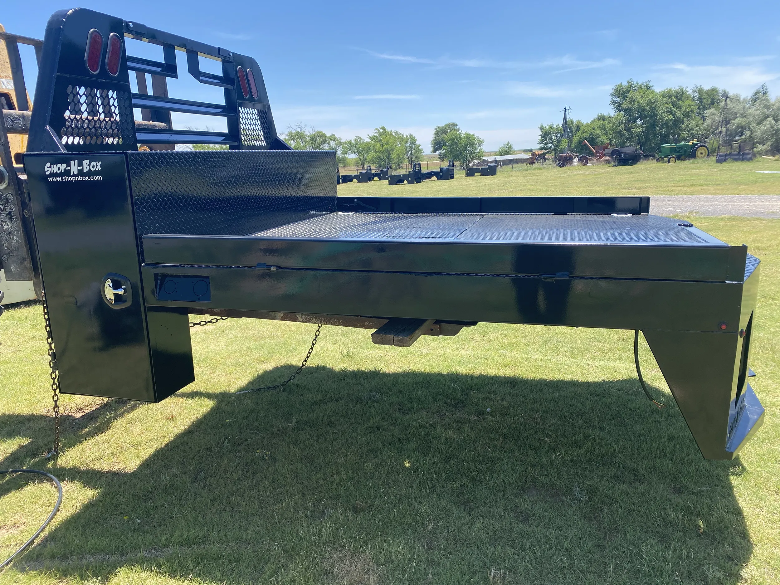 Shop-N-Box non-skirted flatbed truck bed with headache rack rollout storage